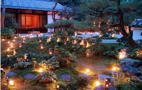 Kyoto temple garden lit up with candles